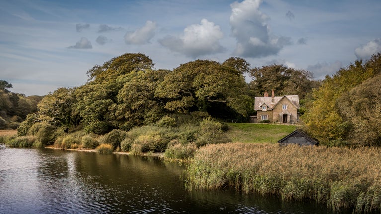 An aerial view of Helston Lodge overlooking Loe Pool, Cornwall